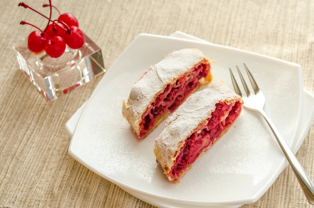 Cherry strudel on the square plate