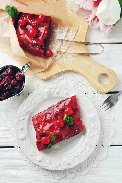 Cherry strudel with mint on plate