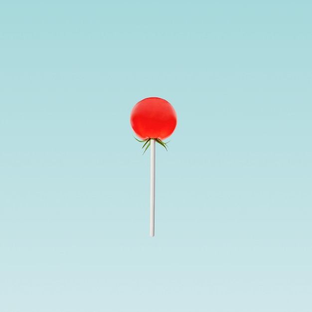 Cherry tomato like red lollipop in studio on pastel blue background. Minimal concept.