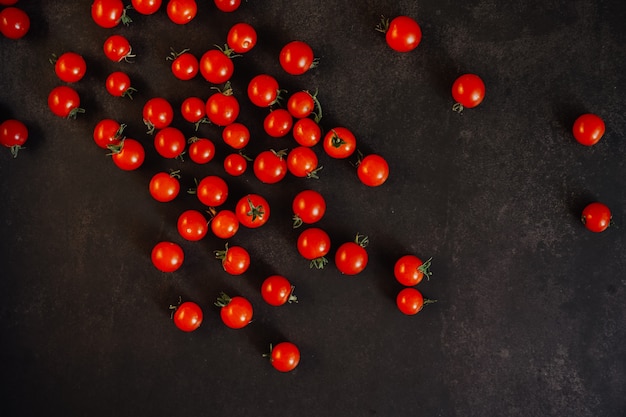 cherry tomatoes on a black surface