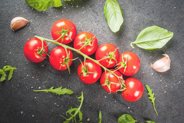 Cherry tomatoes on dark stone table