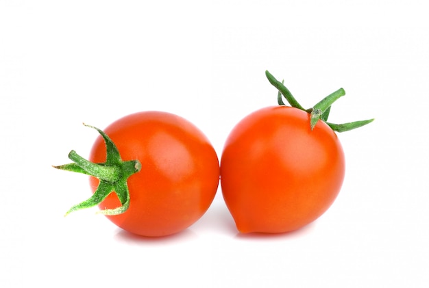 Cherry tomatoes isolated on white wall