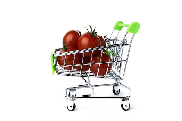 Cherry tomatoes in a mini supermarket trolley, isolated