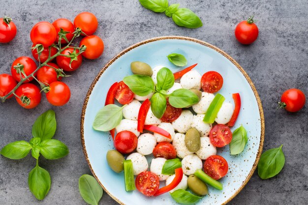 Cherry tomatoes, mozzarella cheese, basil and spices