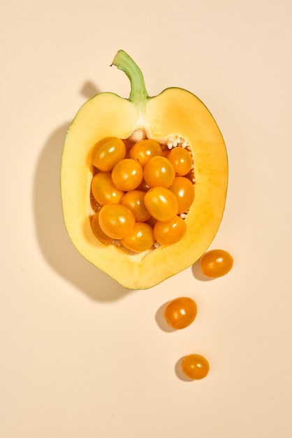 cherry tomatoes and papaya isolated on pastel background for vegans and vegetarians ready for product display