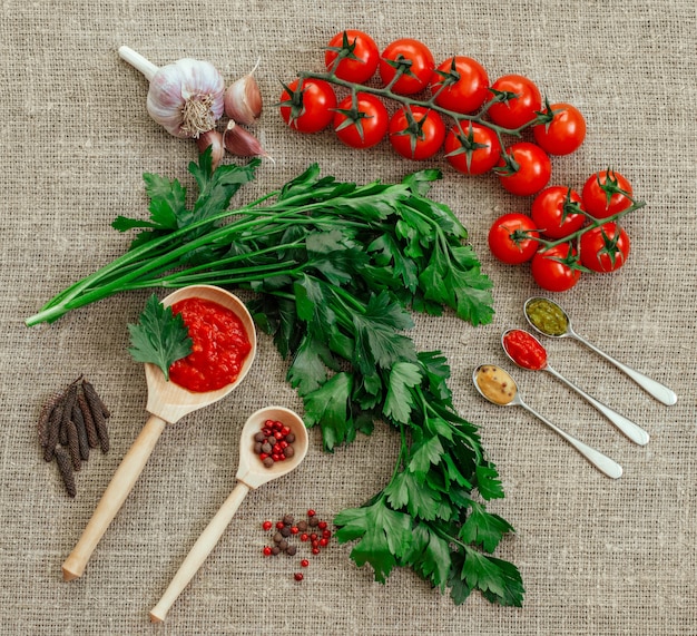 Cherry tomatoes and parsley with an assortment of spices