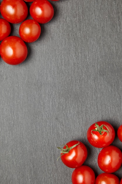 Cherry tomatoes over stone table.