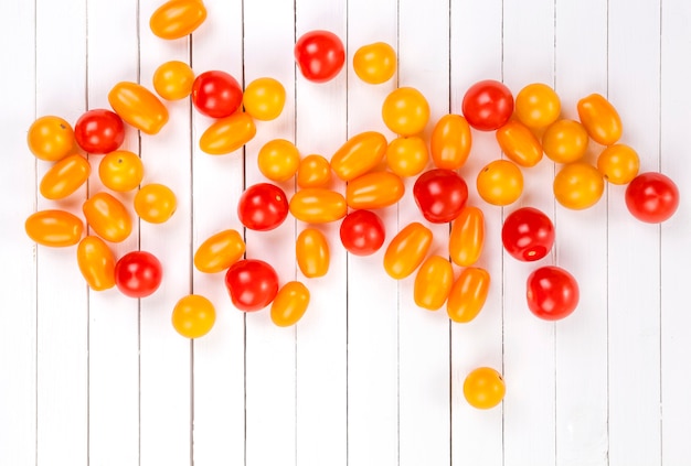 Cherry tomatoes on white surface