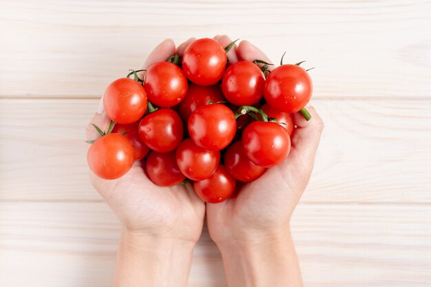 Cherry tomatoes on the white wooden table