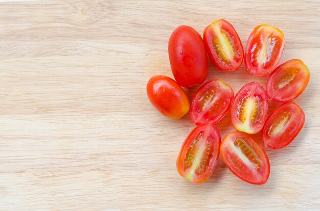 cherry tomatoes on wooden cutting board