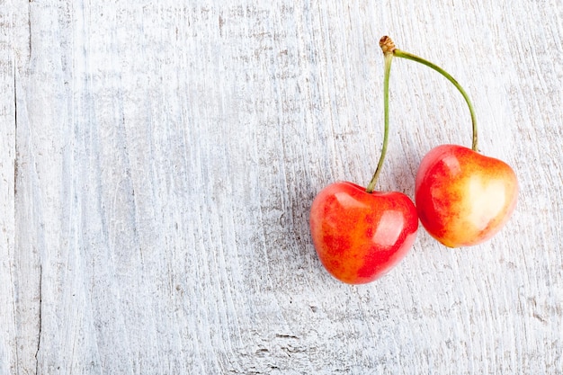 Cherry on wooden background close-up