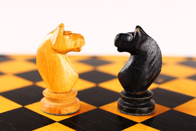 Chess black horse opposite white