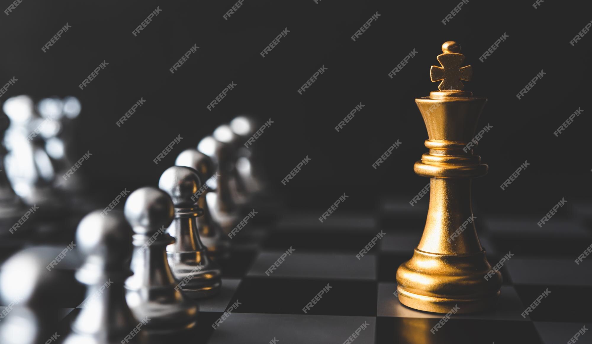 Investment Leadership Concept : The king chess piece with chess others  nearby go down from floating board game concept of business ideas and  competition and strategy plan success meaning. Stock Photo