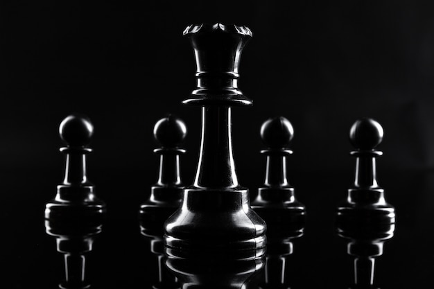 Photo chess figures on dark black  close up