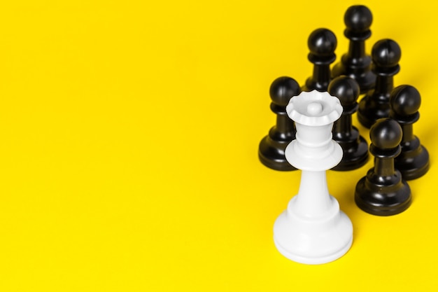 Chess figures on yellow 