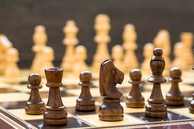 The chess game pieces on a chess board