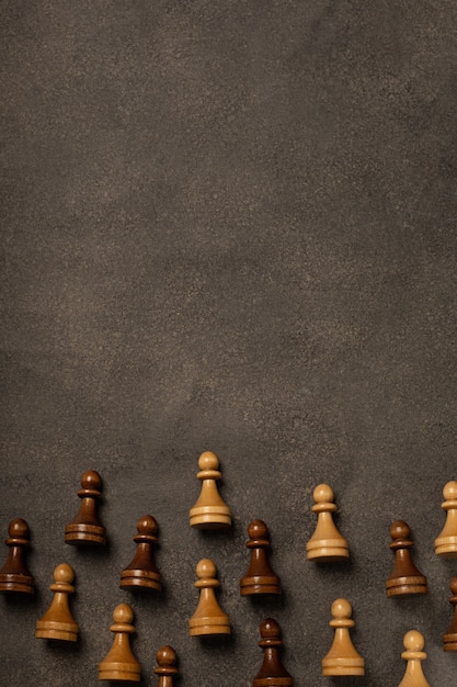 Chess pawns on dark background