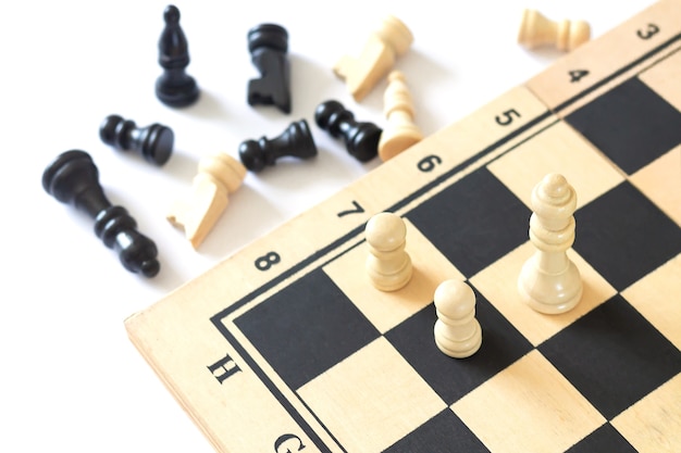 Chess pieces on chess board game top view