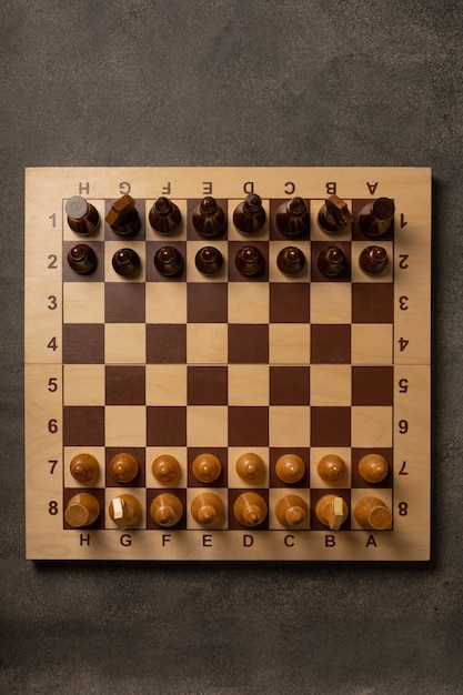 Chess pieces on a chessboard on a dark background