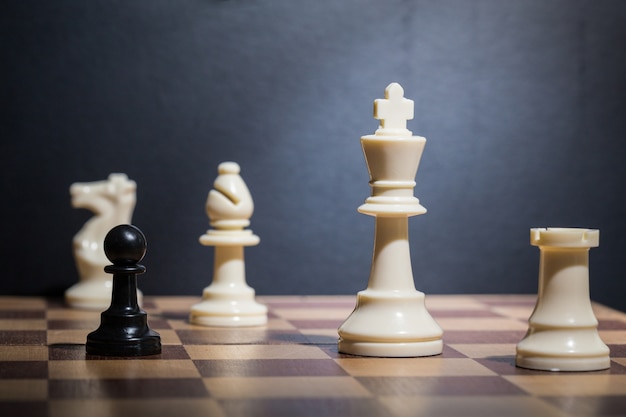 Chess pieces set on a chessboard