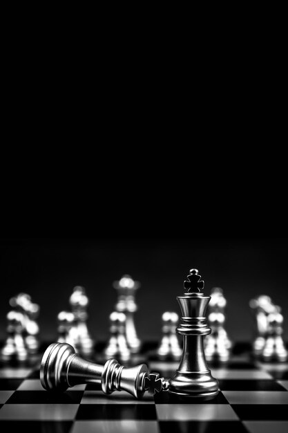 Chess pieces stand with team concepts of challenge and leadership