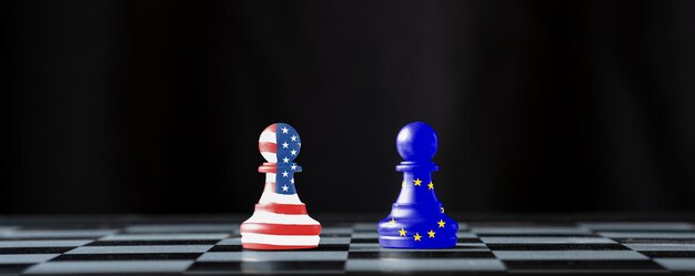 Photo chess pieces with flags against black background