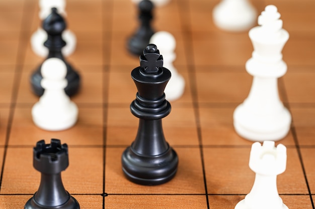 Chess pieces on wood chessboard