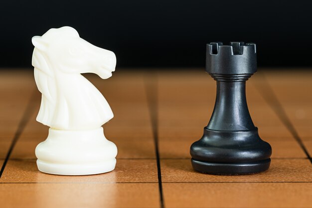 Chess pieces on a wood chessboard