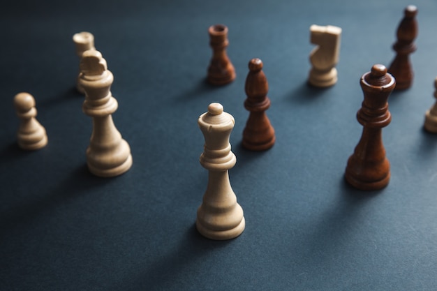 Chess stones on the dark background