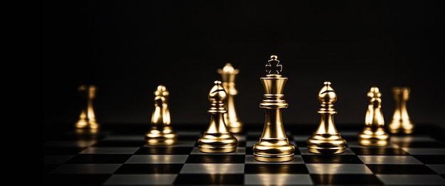 Chess team standing on the board.