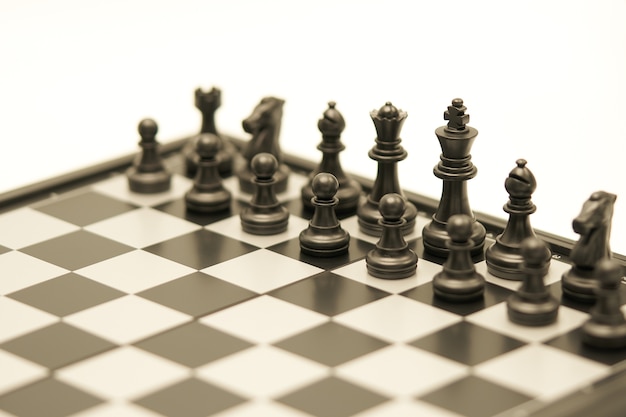 Chessboard with a chess piece on the back Negotiating in business.