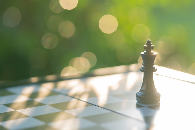 Chessboard with a chess piece on the back Negotiating in business. 