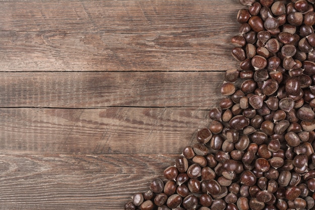 Chestnut on wooden background