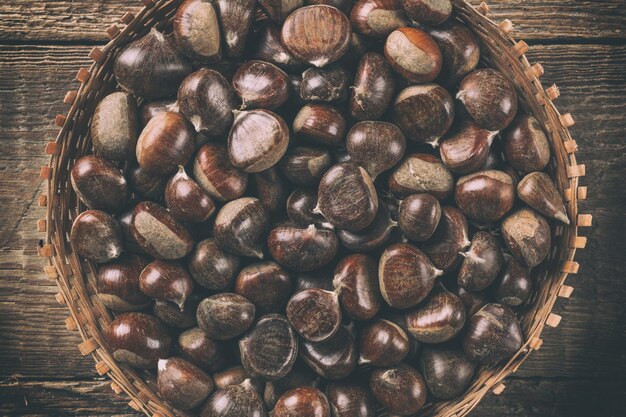 Chestnut on wooden background