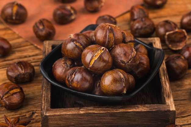 chestnuts on a wooden background.