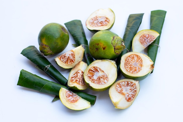 Chewing betel nut Betel nut with cal lime powder on betel leaves