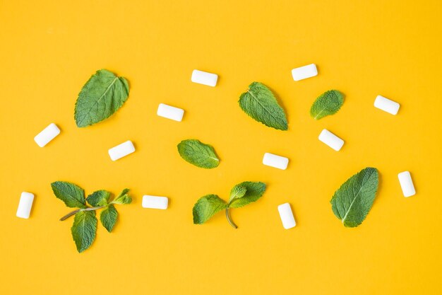 Chewing gum with mint on yellow background