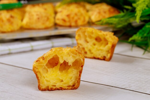 Chewy cheese bread called chipa on wooden table.