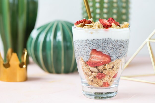 Chia pudding with almond milk, yogurt, and dried strawberries.