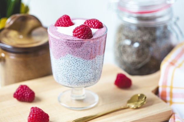 Chia pudding with almond milk yogurt pitaya powder and raspberries vegan concept