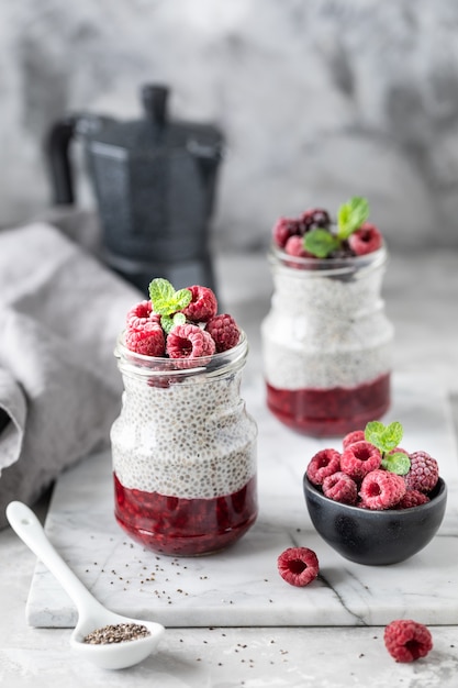 Chia pudding with fresh berries in glass jar. Concept of healthy eating, healthy lifestyle, dieting, fitness