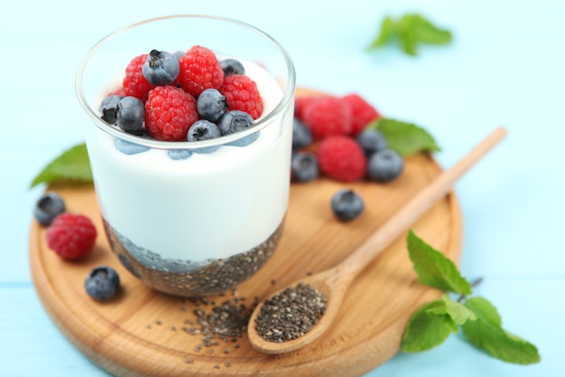 Chia pudding with natural yogurt and fresh berries closeup on the table