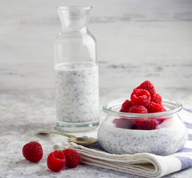 chia pudding with raspberries, light background