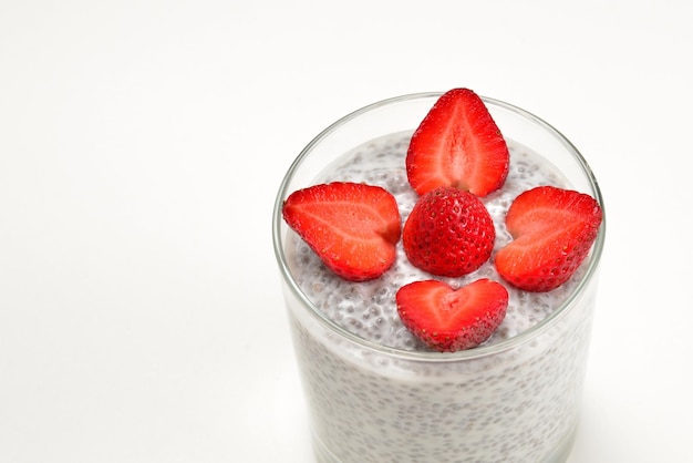 Chia pudding with strawberry on a white background Space for text or design