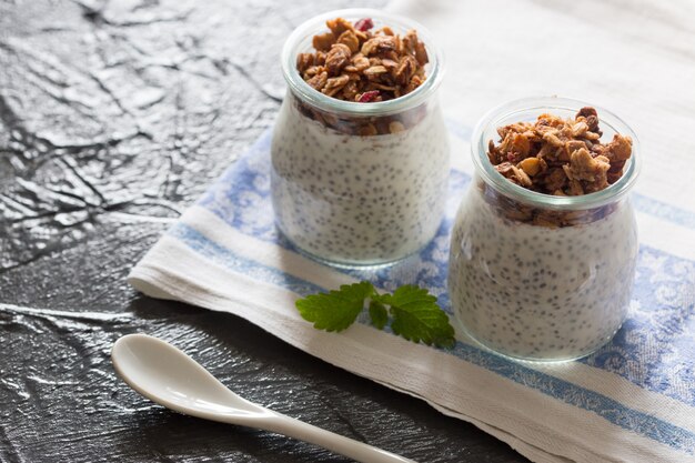 Chia seed pudding with granola in a glass jar