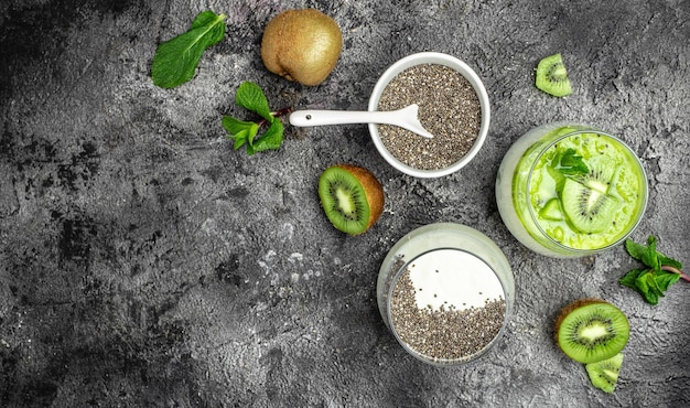 Chia Seed with milk kiwi and mint on light background lactosefree yogurt Delicious breakfast or snack Clean eating dieting vegan food concept top view