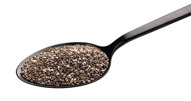 Chia seeds in black spoon isolated on white