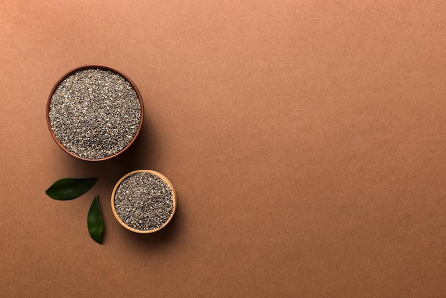 Chia seeds in bowl on colored background Healthy Salvia hispanica in small bowl Healthy superfood