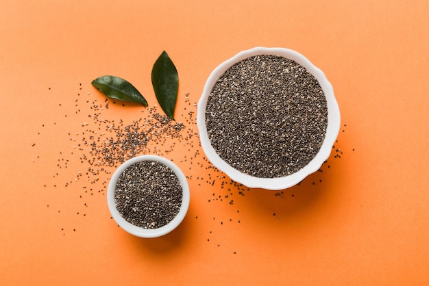 Chia seeds in bowl on colored background Healthy Salvia hispanica in small bowl Healthy superfood