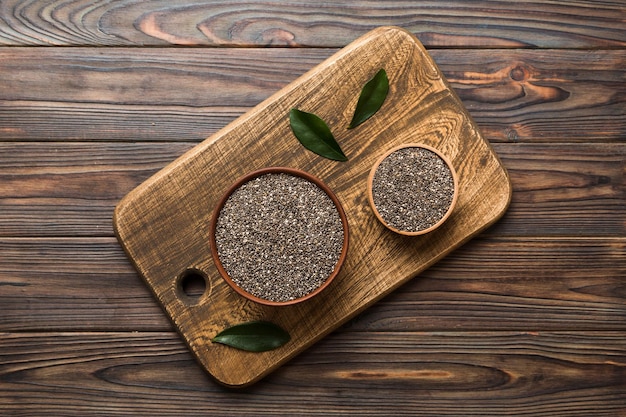 Chia seeds in bowl on colored background Healthy Salvia hispanica in small bowl Healthy superfood